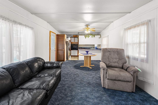 N10678 US Highway 151, Malone, WI 53049 - living area featuring carpet flooring, ceiling fan, and vaulted ceiling