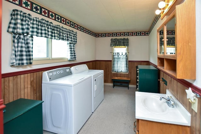 735 Oakwood St, Wild Rose, WI 54984 - laundry area featuring washer and clothes dryer, a wainscoted wall, wood walls, and light carpet