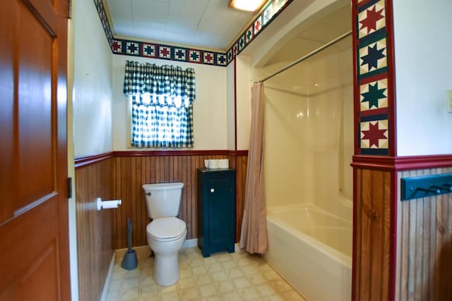 735 Oakwood St, Wild Rose, WI 54984 - bathroom with a wainscoted wall, toilet, shower / bath combination with curtain, and tile patterned floors