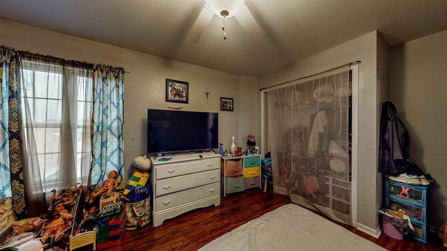 619 Reena Ave Unit 8, Fort Atkinson, WI 53538 - bedroom with dark wood-style flooring, a closet, and ceiling fan