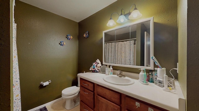 619 Reena Ave Unit 8, Fort Atkinson, WI 53538 - full bathroom featuring vanity, toilet, tile patterned flooring, and a shower with curtain