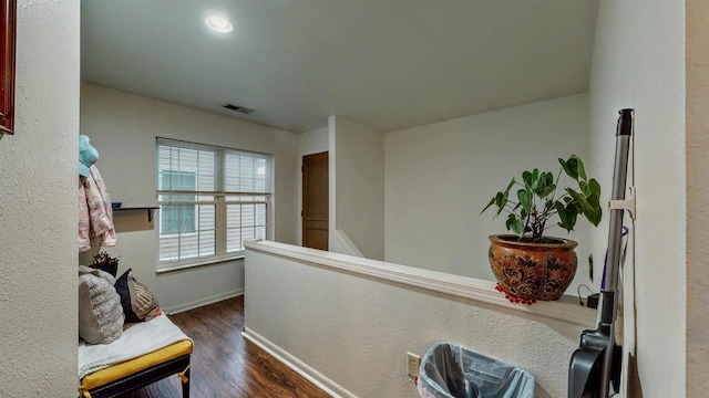 619 Reena Ave Unit 8, Fort Atkinson, WI 53538 - hallway with dark wood finished floors, baseboards, and an upstairs landing