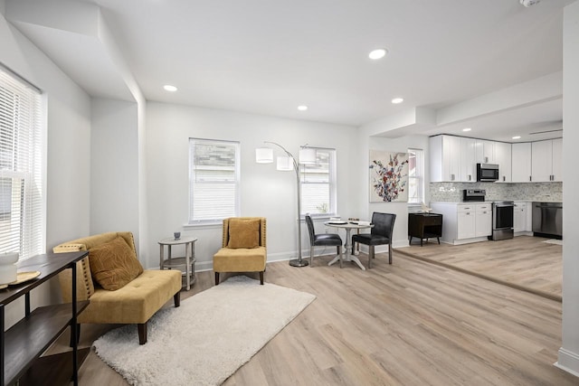 1922 E Iron St, Milwaukee, WI 53207 - living area featuring light wood finished floors, baseboards, and recessed lighting