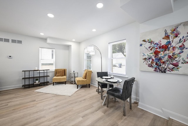 1922 E Iron St, Milwaukee, WI 53207 - living area with plenty of natural light, recessed lighting, wood finished floors, and baseboards