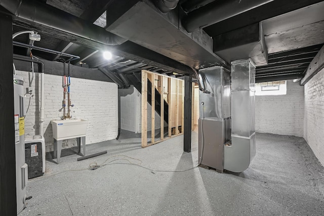 1922 E Iron St, Milwaukee, WI 53207 - basement with brick wall, heating unit, stairway, and electric water heater