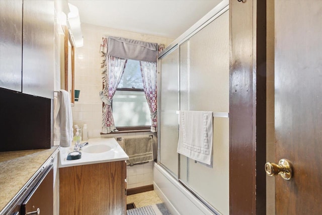 N1815 County Road T, Brodhead, WI 53520 - full bath with vanity, tile walls, and enclosed tub / shower combo