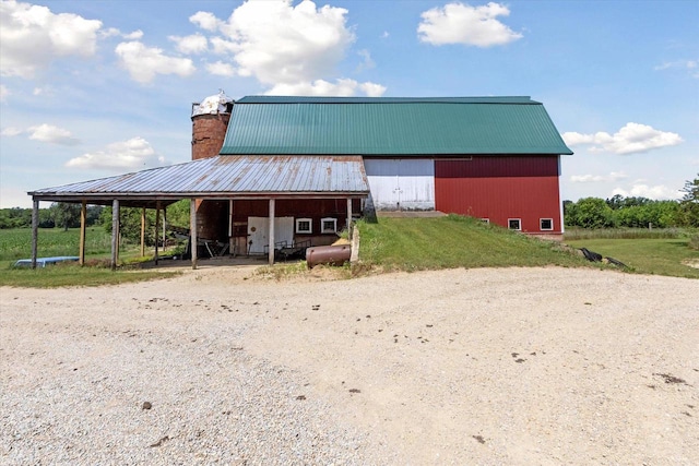 N1815 County Road T, Brodhead, WI 53520 - view of pole building featuring dirt driveway and a yard