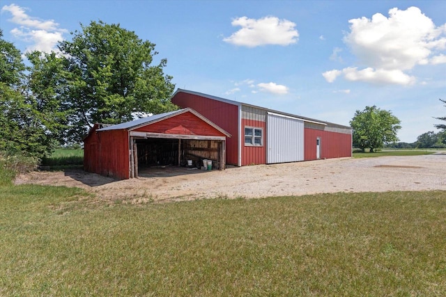N1815 County Road T, Brodhead, WI 53520 - view of pole building with a yard