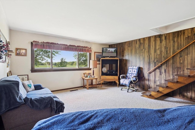 N1815 County Road T, Brodhead, WI 53520 - living room with carpet, wooden walls, and stairway