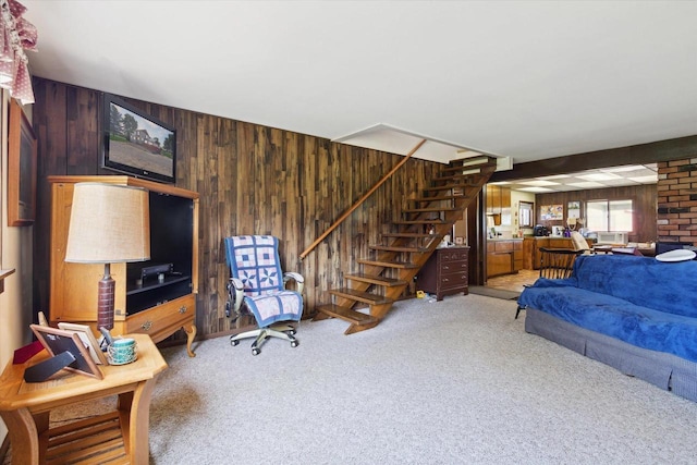 N1815 County Road T, Brodhead, WI 53520 - living room with wood walls, light colored carpet, and stairs