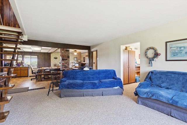 N1815 County Road T, Brodhead, WI 53520 - living area featuring a ceiling fan, carpet floors, ornate columns, and wood walls