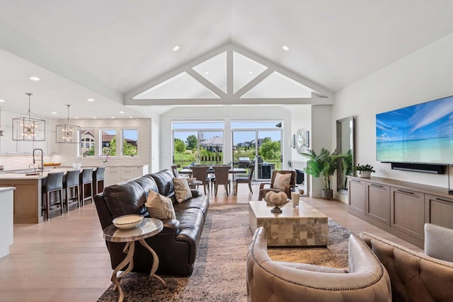 7678 Badger Run Ct, Verona, WI 53593 - living room featuring a chandelier, recessed lighting, light wood finished floors, and high vaulted ceiling