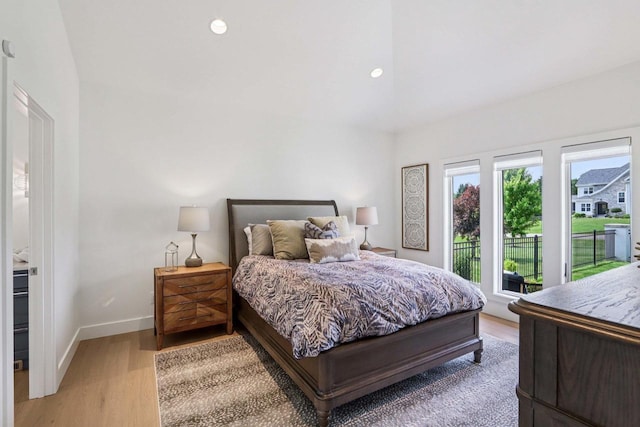 7678 Badger Run Ct, Verona, WI 53593 - bedroom with access to exterior, light wood-type flooring, baseboards, and recessed lighting