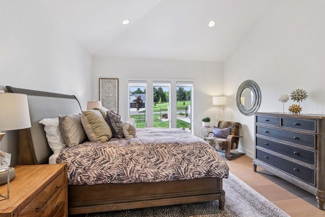 7678 Badger Run Ct, Verona, WI 53593 - bedroom with vaulted ceiling, light wood-type flooring, and recessed lighting