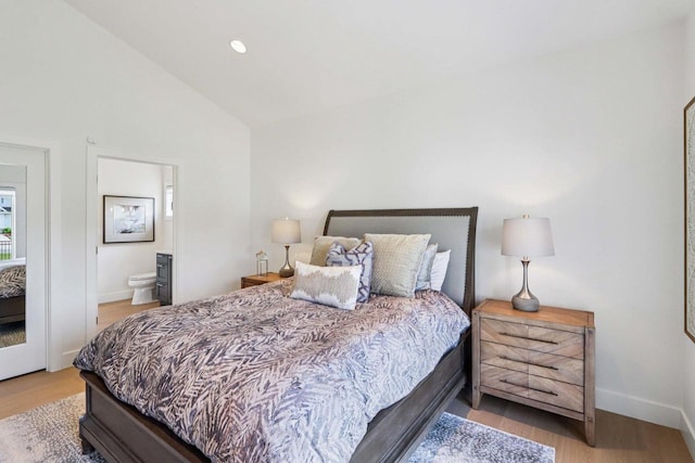 7678 Badger Run Ct, Verona, WI 53593 - bedroom with wood finished floors, baseboards, connected bathroom, recessed lighting, and high vaulted ceiling