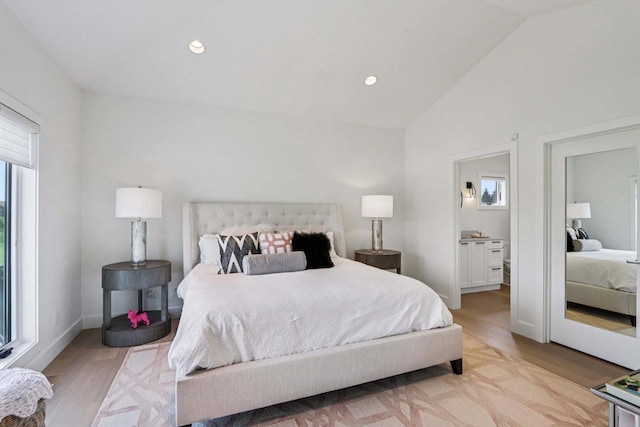 7678 Badger Run Ct, Verona, WI 53593 - bedroom with lofted ceiling, light wood-style floors, and recessed lighting