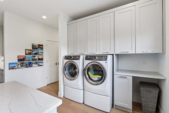 7678 Badger Run Ct, Verona, WI 53593 - laundry area with cabinet space, light wood finished floors, washer and clothes dryer, and recessed lighting