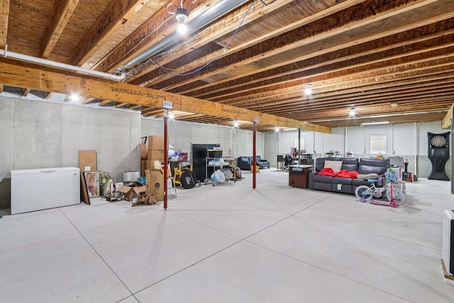 7678 Badger Run Ct, Verona, WI 53593 - unfinished below grade area featuring refrigerator