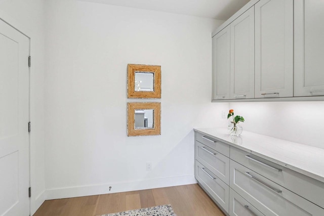 7678 Badger Run Ct, Verona, WI 53593 - interior space featuring light wood-style flooring and baseboards