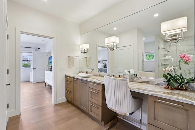7678 Badger Run Ct, Verona, WI 53593 - bathroom featuring ensuite bathroom, wood finished floors, vanity, plenty of natural light, and recessed lighting