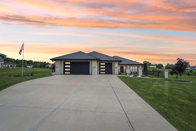 7678 Badger Run Ct, Verona, WI 53593 - view of front of home featuring an attached garage, concrete driveway, stucco siding, and roof with shingles