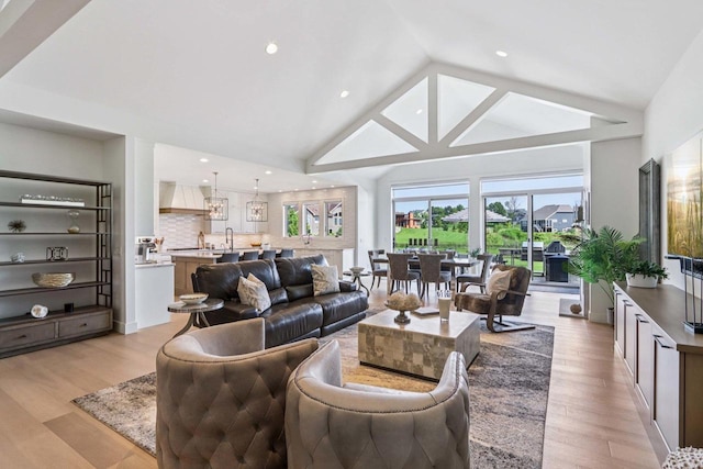 7678 Badger Run Ct, Verona, WI 53593 - living area featuring light wood finished floors, high vaulted ceiling, and recessed lighting