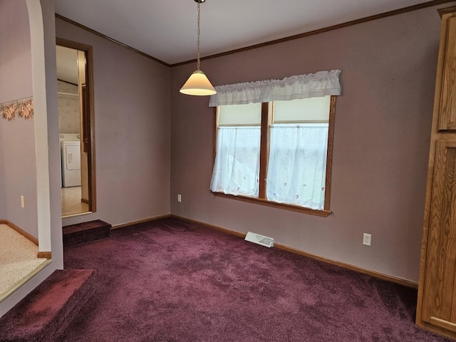 7102 Fire Tower Rd, Rhinelander, WI 54501 - spare room featuring washer / dryer, crown molding, dark carpet, and baseboards