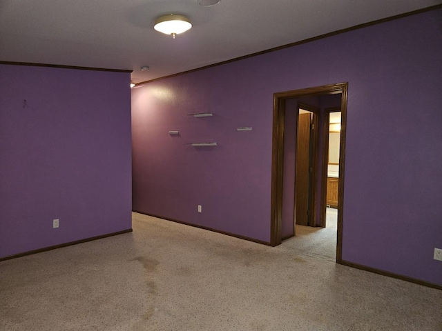 7102 Fire Tower Rd, Rhinelander, WI 54501 - spare room featuring ornamental molding and baseboards