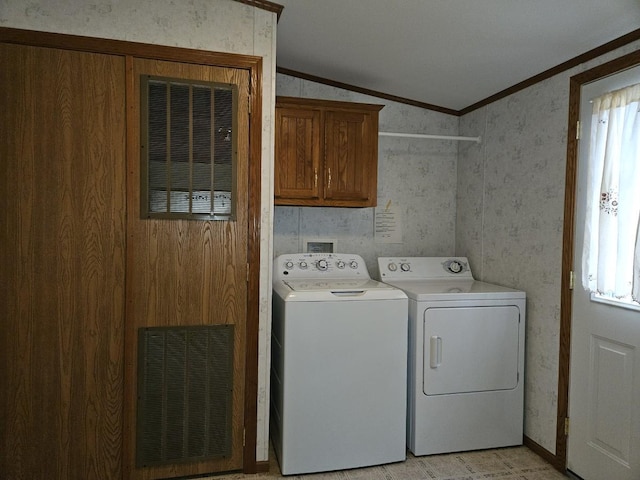 7102 Fire Tower Rd, Rhinelander, WI 54501 - laundry room with cabinet space, ornamental molding, washing machine and dryer, and wallpapered walls