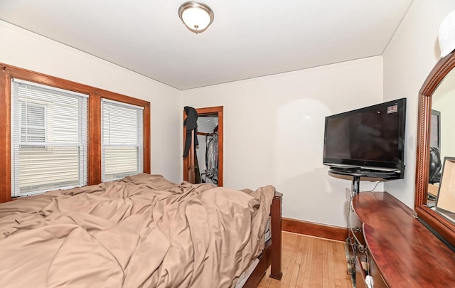 2355 N 59th St Unit 2357, Milwaukee, WI 53210 - bedroom featuring light wood-type flooring, baseboards, and a spacious closet