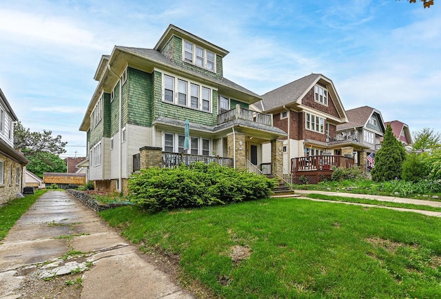 2355 N 59th St Unit 2357, Milwaukee, WI 53210 - american foursquare style home with a balcony, a front yard, and a wooden deck