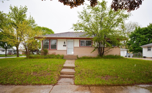 7928 W Clovernook St, Milwaukee, WI 53223 - view of front of home featuring entry steps, a front lawn, and brick siding