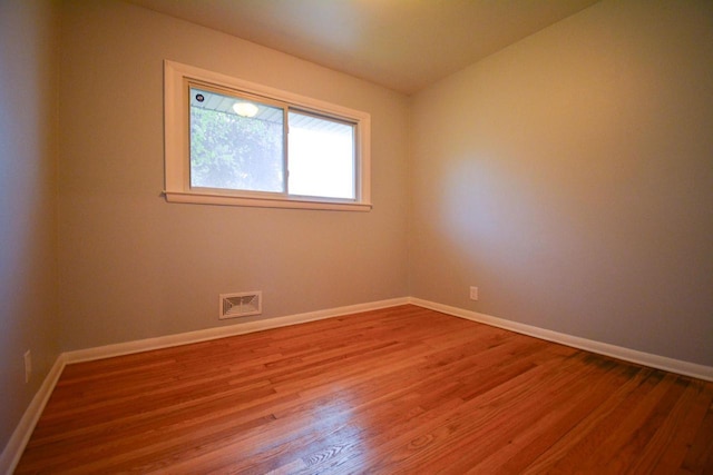 7928 W Clovernook St, Milwaukee, WI 53223 - empty room featuring wood finished floors and baseboards