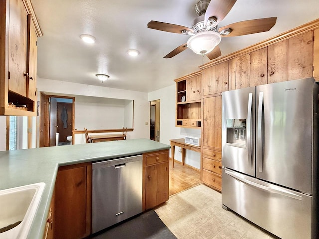 3117 Canterbury Ln, Janesville, WI 53546 - kitchen with stainless steel appliances, light floors, ceiling fan, open shelves, and a sink