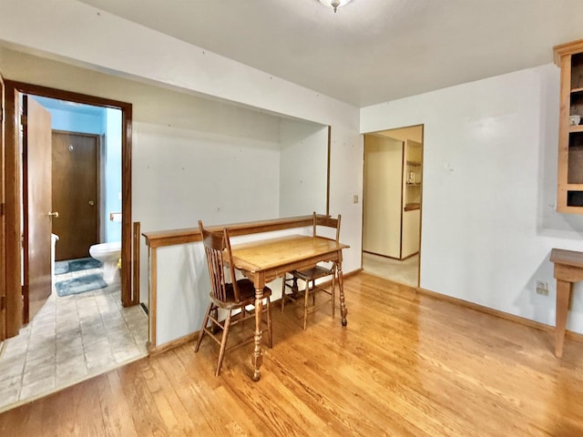 3117 Canterbury Ln, Janesville, WI 53546 - dining room featuring light wood-style floors and baseboards