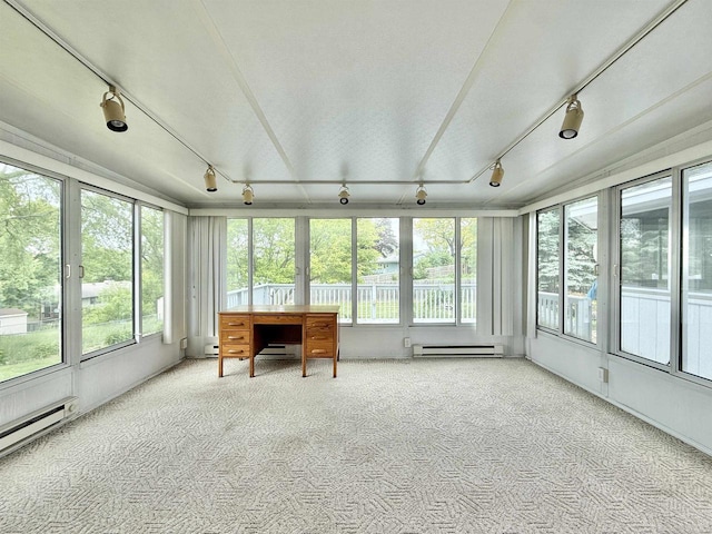 3117 Canterbury Ln, Janesville, WI 53546 - sunroom featuring rail lighting, a baseboard radiator, plenty of natural light, and carpet