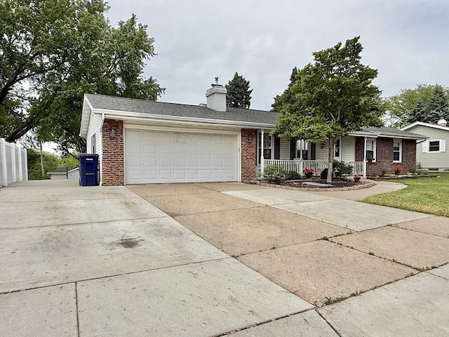 3117 Canterbury Ln, Janesville, WI 53546 - ranch-style house featuring brick siding, covered porch, a chimney, concrete driveway, and a garage