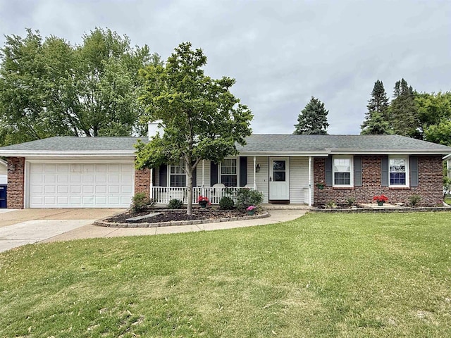 3117 Canterbury Ln, Janesville, WI 53546 - single story home with a garage, brick siding, covered porch, and concrete driveway