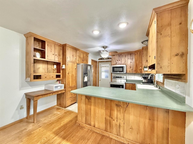 3117 Canterbury Ln, Janesville, WI 53546 - kitchen with appliances with stainless steel finishes, a sink, ceiling fan, a peninsula, and open shelves