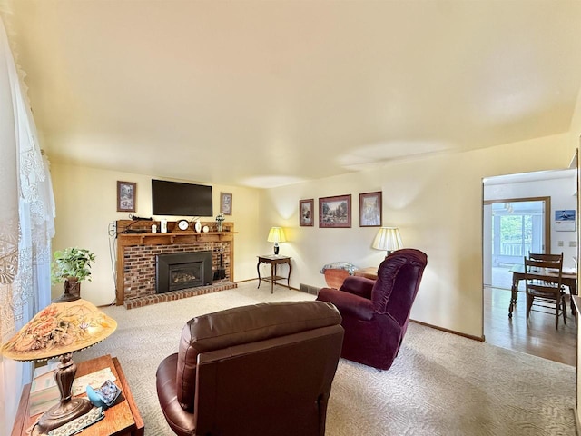 3117 Canterbury Ln, Janesville, WI 53546 - living room with carpet, a fireplace, and baseboards
