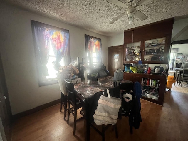 1451 S Union St, Milwaukee, WI 53204 - dining space featuring a ceiling fan, wood finished floors, and a textured ceiling