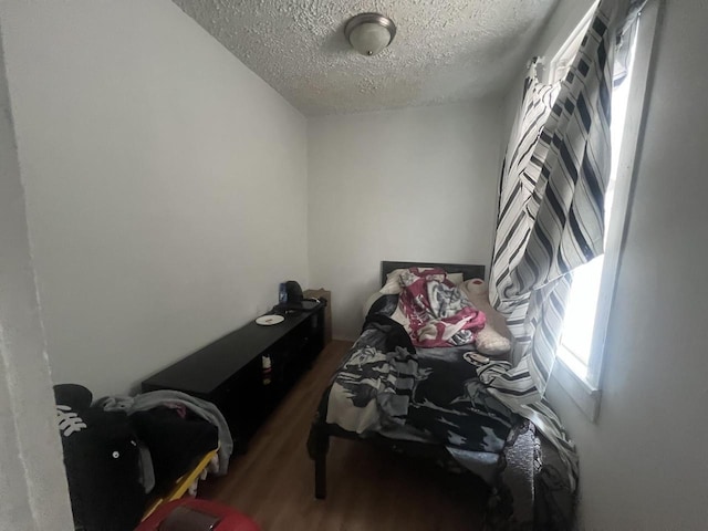 1451 S Union St, Milwaukee, WI 53204 - bedroom featuring wood finished floors and a textured ceiling