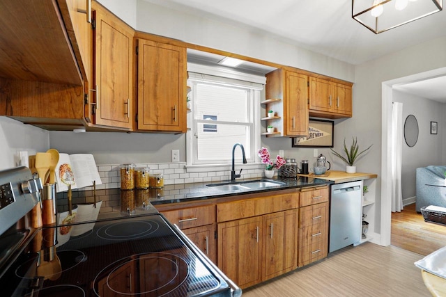 3725 Dawes St, Madison, WI 53714 - kitchen featuring stainless steel dishwasher, a sink, open shelves, brown cabinets, and light wood-style flooring