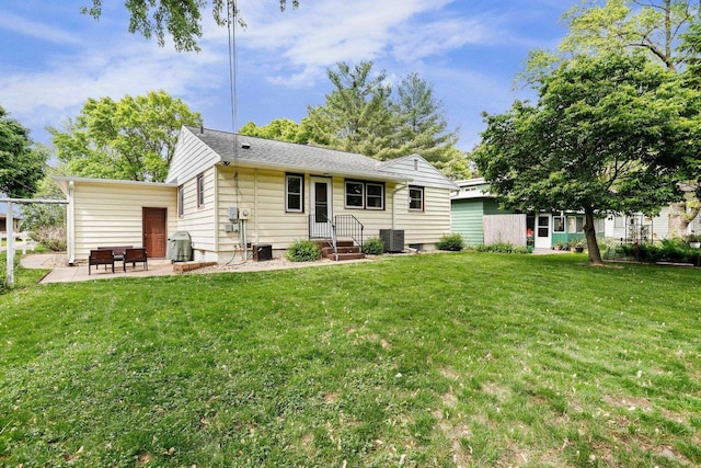 3725 Dawes St, Madison, WI 53714 - back of house featuring a patio, cooling unit, and a lawn