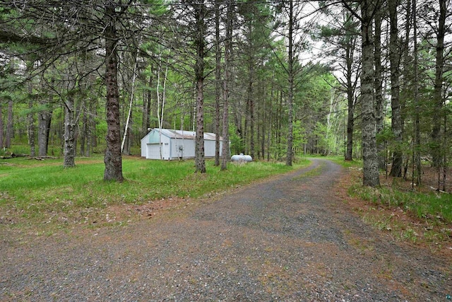 2775 Lake Rd, Barnes, WI 54873 - view of dirt / gravel driveway with a wooded view