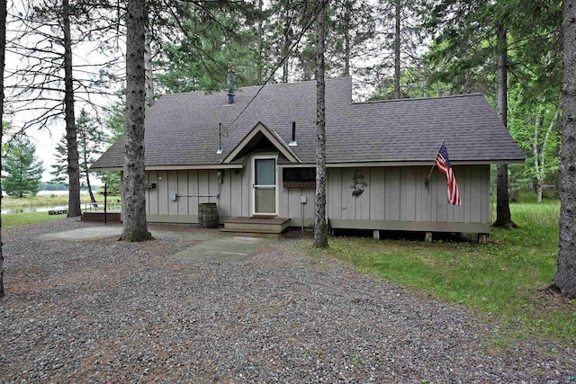 2775 Lake Rd, Barnes, WI 54873 - view of front of home featuring roof with shingles, board and batten siding, and a water view