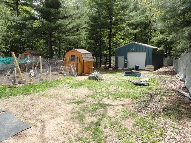 W4643 S Pearl Lake Rd, Redgranite, WI 54970 - view of yard with a detached garage