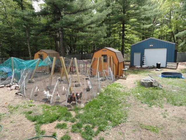 W4643 S Pearl Lake Rd, Redgranite, WI 54970 - view of yard with an outdoor fire pit and a detached garage