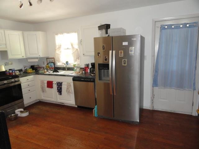 W4643 S Pearl Lake Rd, Redgranite, WI 54970 - kitchen featuring stainless steel appliances, white cabinetry, and dark wood-style flooring
