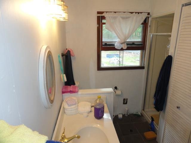 W4643 S Pearl Lake Rd, Redgranite, WI 54970 - bathroom featuring a shower stall and a sink